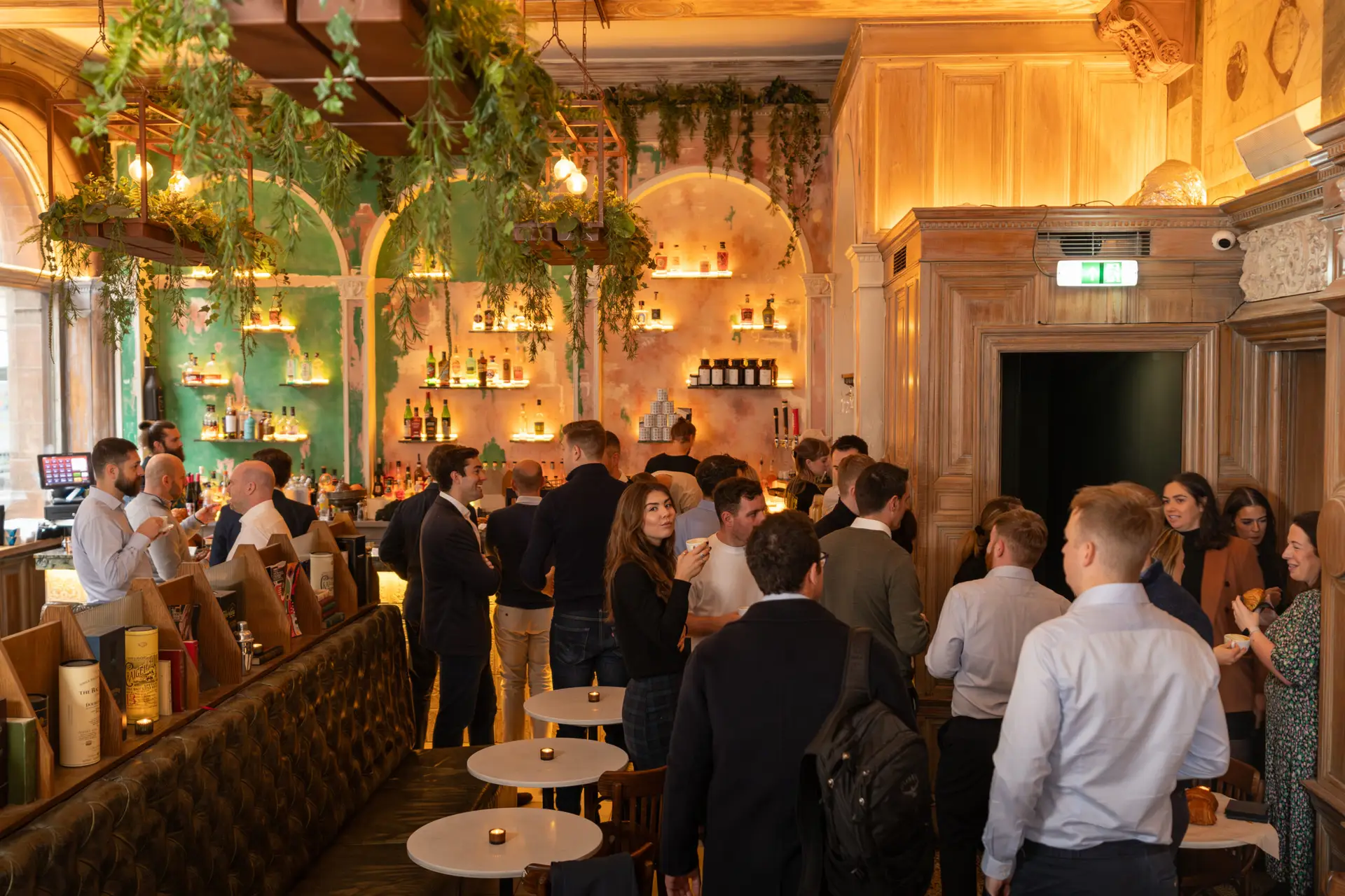 Group of peers networking in a coffee shop, building partnerships